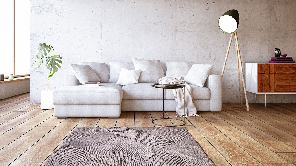 Weiße Couch auf einem hellen Echthozboden